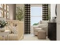 Comfortable Bedroom with crib, chair, and stylish black and white curtains at 10261 Trumpet Honeysuckle Way, San Antonio, FL 33576