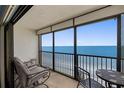 Enjoy stunning ocean views from the balcony with seating arrangements, ideal for morning coffee at 14950 Gulf Blvd # 905, Madeira Beach, FL 33708