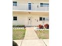 Charming condo entrance featuring well-manicured landscaping and a cozy front patio at 2262 Swedish Dr # 6, Clearwater, FL 33763