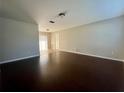 Spacious living room with hardwood floors and sliding glass doors leading to the outdoors at 404 Water St, Plant City, FL 33563