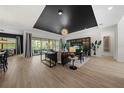 Comfortable living room with large windows, stylish furnishings, and a great view at 7922 Lakes Edge Ln, Port Charlotte, FL 33981