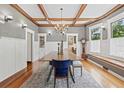 Elegant dining room boasting coffered ceilings, wood floors, chandelier, and built-in cabinets at 1005 Main St, Safety Harbor, FL 34695