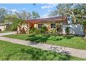 Lovely single-story home with a lush green lawn and mature landscaping at 11125 117Th St, Seminole, FL 33778