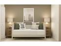 Bedroom featuring white daybed with decorative pillows flanked by side tables with lamps and art at 13535 White Gold Run, Parrish, FL 34219