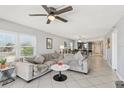 Spacious living room with views of the dining area and the open concept layout at 14401 Gulf Blvd # 106, Madeira Beach, FL 33708