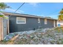 Rear of the house showing windows and a door, surrounded by a well-kept lawn at 243 45Th N St, St Petersburg, FL 33713