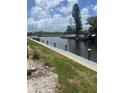 Scenic view of a tranquil waterway with lush green surroundings at 376 Moorings Cove Dr # 6C, Tarpon Springs, FL 34689
