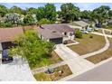 An aerial view of the property, highlighting the home's position in a tranquil neighborhood with mature trees at 6826 Rosemary Dr, Tampa, FL 33625