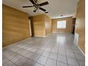 Large, open living area with tile floors, ceiling fan, and lots of natural light at 7001 86Th N Ave, Pinellas Park, FL 33782