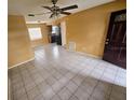 Spacious living room provides an open view to the kitchen area, and boasts tiled floors at 7001 86Th N Ave, Pinellas Park, FL 33782