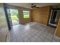Inviting living room features neutral walls and tile flooring for a clean and spacious feel at 7001 86Th N Ave, Pinellas Park, FL 33782