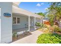 Inviting front porch with shade, desert landscaping, and decorative house number at 743 43Rd Ne Ave, St Petersburg, FL 33703