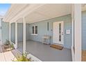Inviting front porch with shade, cactus landscaping, and new door with mail slot at 743 43Rd Ne Ave, St Petersburg, FL 33703