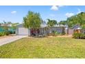 Charming single-story home with a well-manicured front yard and driveway at 743 43Rd Ne Ave, St Petersburg, FL 33703