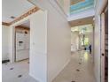 Bright foyer with tile floors, high ceilings, and clerestory windows above at 8980 Antigua Dr, Seminole, FL 33777