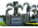 Stone sign for Summers Cay community surrounded by palm trees and lush landscaping at 9512 Summers Cay Cir, Thonotosassa, FL 33592