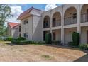 Charming multi-story condo building with balconies and landscaped grounds at 9700 Starkey Rd # 325, Seminole, FL 33777