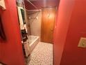 Full bathroom featuring a tiled shower-tub combination, and a bright-colored wall at 11394 Collingswood St, Spring Hill, FL 34608