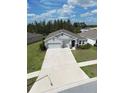 An aerial shot showcasing the home's front yard and surrounding landscape at 13111 Pepper Stem St, Spring Hill, FL 34609