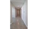 Hallway featuring neutral tones and tile flooring at 13111 Pepper Stem St, Spring Hill, FL 34609