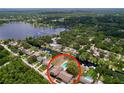 Aerial shot of a waterfront property with a private pool and access to the canal at 1902 Rebecca Rd, Lutz, FL 33548