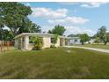 Delightful single-Gathering home with manicured lawn and convenient carport at 2044 Temple Ter, Clearwater, FL 33764