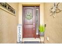 Inviting front entrance adorned with decorative accents and a charming welcome sign at 222 Toscavilla Blvd, Nokomis, FL 34275