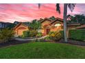 Charming single-story home with a well-manicured lawn and inviting front entrance at 4133 Auston Way, Palm Harbor, FL 34685