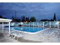 Inviting community pool with lounge chairs and a mural, perfect for relaxation and enjoyment at 4324 Tahitian Gardens Cir # J, Holiday, FL 34691