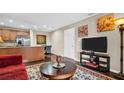Cozy living room featuring an open layout with a dining area and modern decor at 4812 Jasper Dr # 203, New Port Richey, FL 34652