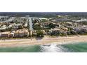 Scenic aerial view of the coastline with beaches, condos, and waterways at 512 1St St # 108, Indian Rocks Beach, FL 33785