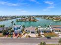 Beautiful waterfront property with lush landscaping and a private dock for boating and water activities at 600 115Th Ave, Treasure Island, FL 33706
