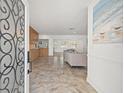 Inviting entryway with tile flooring, open layout and access to living room and kitchen at 629 Fort Duquesna Dr, Sun City Center, FL 33573