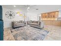 Bright living room featuring tile floors, stylish decor, and an open layout at 629 Fort Duquesna Dr, Sun City Center, FL 33573