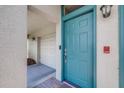 Inviting teal-colored front door, digital keypad, and brick accents offer an easy entry at 731 Cruise View Dr, Tampa, FL 33602