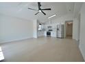 Bright and airy living space featuring an open-concept and a sleek, modern kitchen at 7551 52Nd N St, Pinellas Park, FL 33781