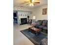 Cozy living room featuring a fireplace and comfortable seating arrangement at 7616 Colonial Ct, Tampa, FL 33615