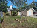 A quaint single-story home with a one car garage is enhanced by a well-kept lawn and a large front yard at 7920 52Nd N St, Pinellas Park, FL 33781