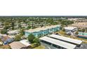 A pleasing exterior view of the community includes a pool at 11447 Park Blvd # 205, Seminole, FL 33772