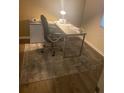 Home office featuring a modern desk, ergonomic chair, and minimalist design at 12619 Richezza Dr, Venice, FL 34293