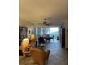 Cozy living room with comfortable seating and a view of the outside balcony at 13313 Gasparilla Rd # 401, Placida, FL 33946