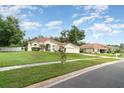 Charming single-story home on a corner lot with a well-maintained lawn, and attached garage at 14266 Creek Run Dr, Riverview, FL 33579