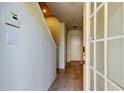 Inviting entryway showcasing tile flooring, neutral walls, a staircase, and a glass-paned door at 1531 Ember Ln, Tarpon Springs, FL 34689