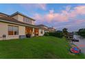 Beautiful backyard featuring a well-kept lawn that backs up to a peaceful lake with a private dock at 18050 Cozumel Isle Dr, Tampa, FL 33647