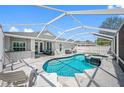 A luxurious pool with a spa and screened-in patio, ideal for outdoor enjoyment and relaxation at 19309 Garden Quilt Cir, Lutz, FL 33558
