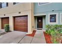 Inviting front entrance with a single-car garage, well-maintained lawn, and walkway at 2435 Edgewater Falls Dr, Brandon, FL 33511