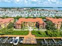 Aerial view of waterfront condos featuring boat slips with easy water access at 2741 Via Cipriani # 934B, Clearwater, FL 33764