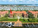 Aerial view of waterfront condos featuring boat slips with easy water access at 2741 Via Cipriani # 934B, Clearwater, FL 33764