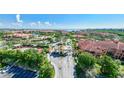 Beautiful entrance to the community featuring manicured landscaping and water views at 2741 Via Cipriani # 934B, Clearwater, FL 33764
