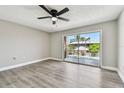Spacious bedroom with new floors and a sliding door to a balcony overlooking the pool at 3515 41St S Ter # 224, St Petersburg, FL 33711